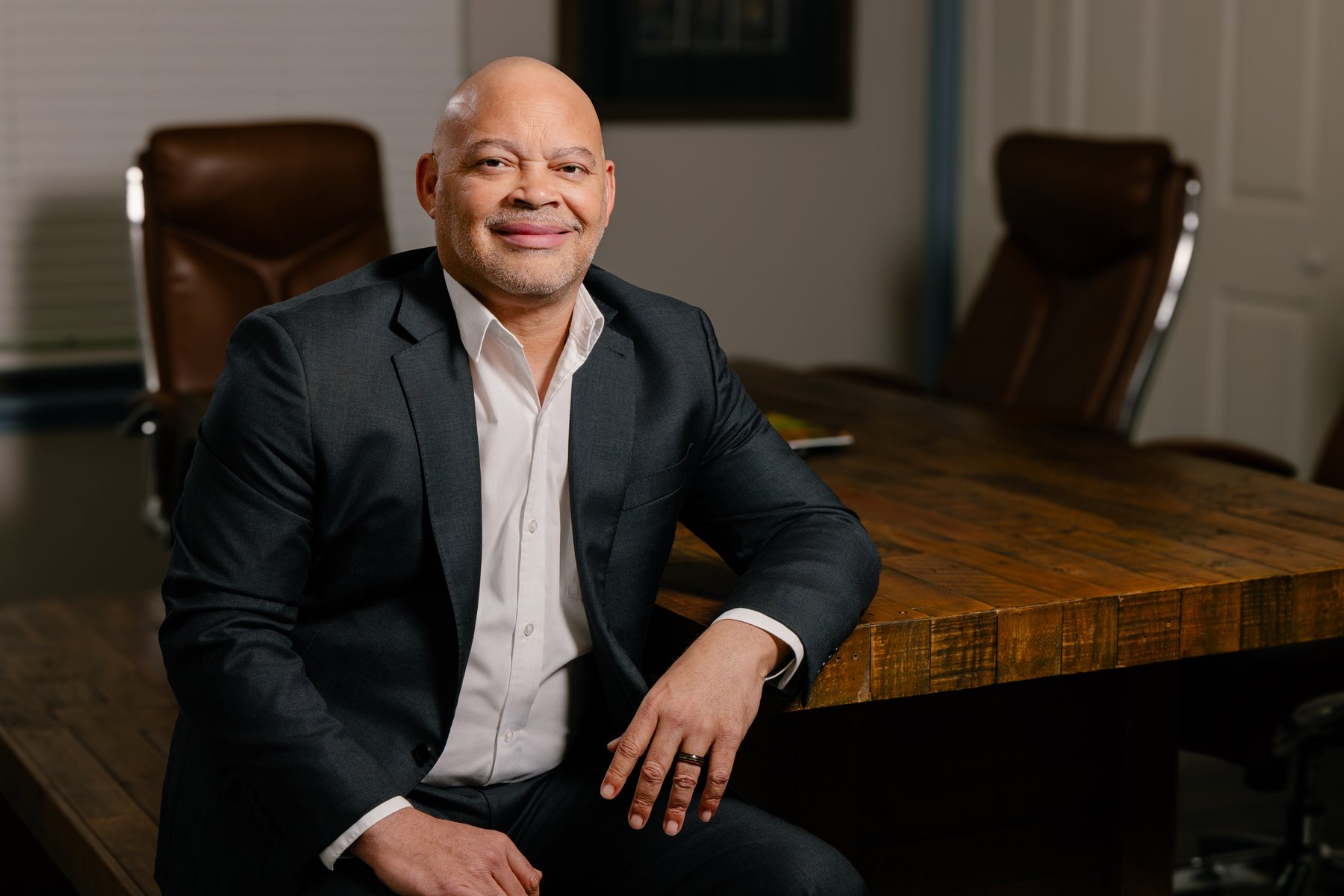 Milton Arceneaux at his desk